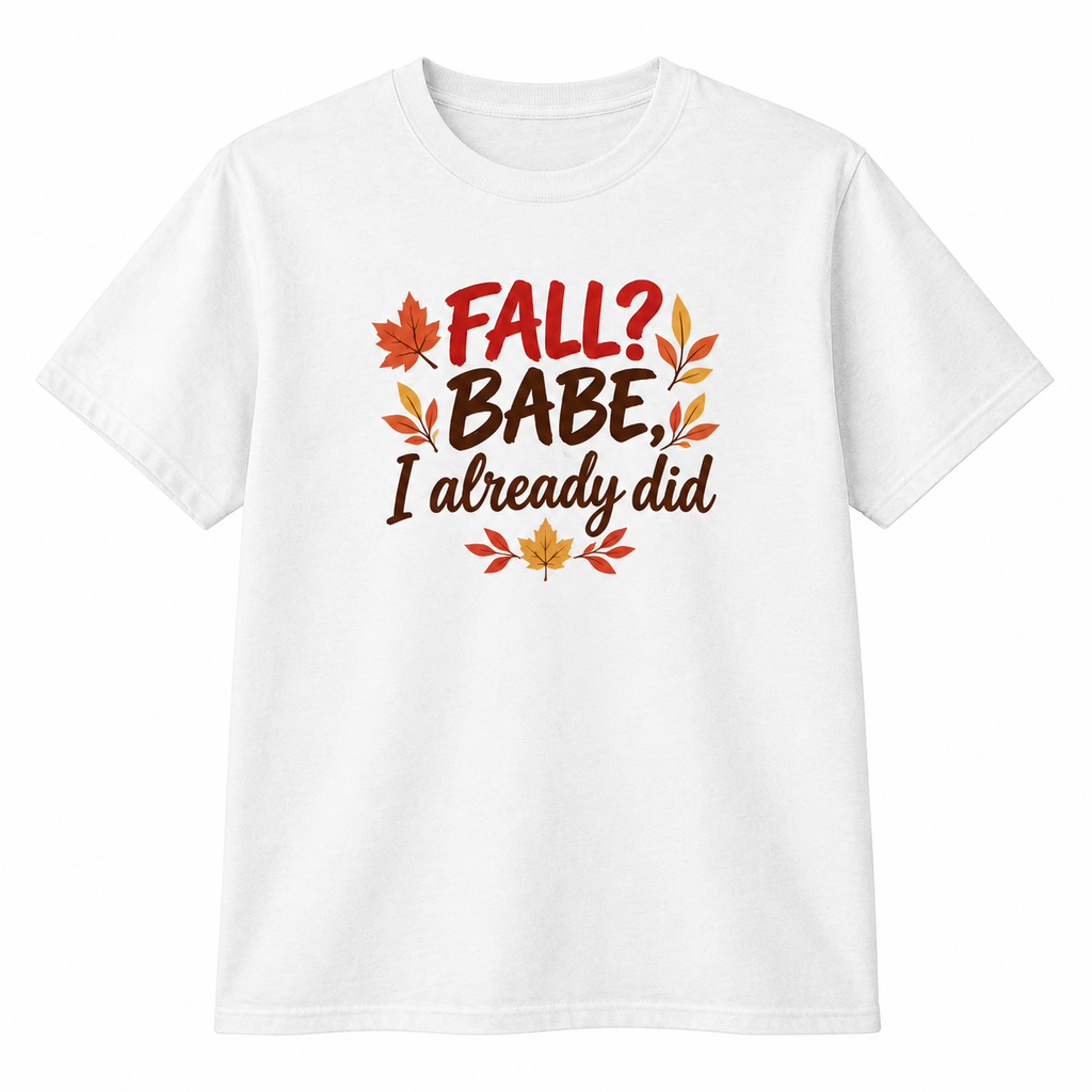 A white short-sleeve crewneck t-shirt featuring a graphic print on the front with the text 'FALL? BABE, I already did' in brown and red lettering, decorated with autumn leaves in orange, red, and yellow.