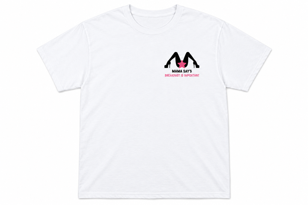 A white short-sleeve crewneck t-shirt with a small graphic on the left chest. The graphic features a black silhouette of a person doing push-ups with a pink heart, above the text 'MAMA LIFETIME BREAKFAST IS IMPORTANT!'.