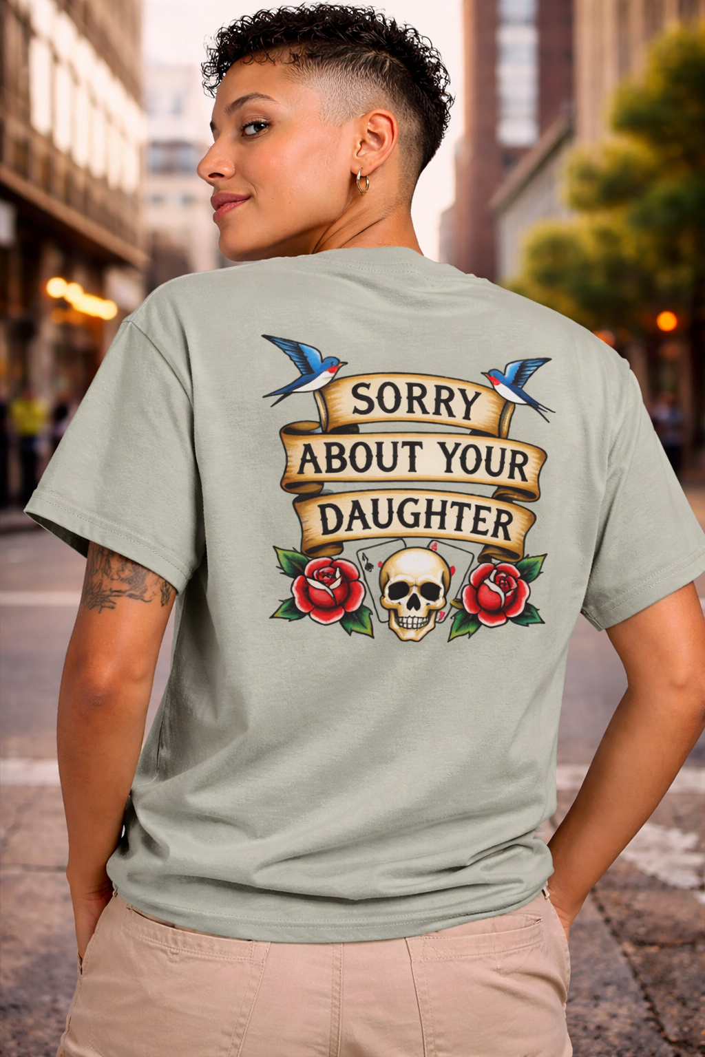 Person wearing a t-shirt with a graphic design on the back, featuring text and symbols.