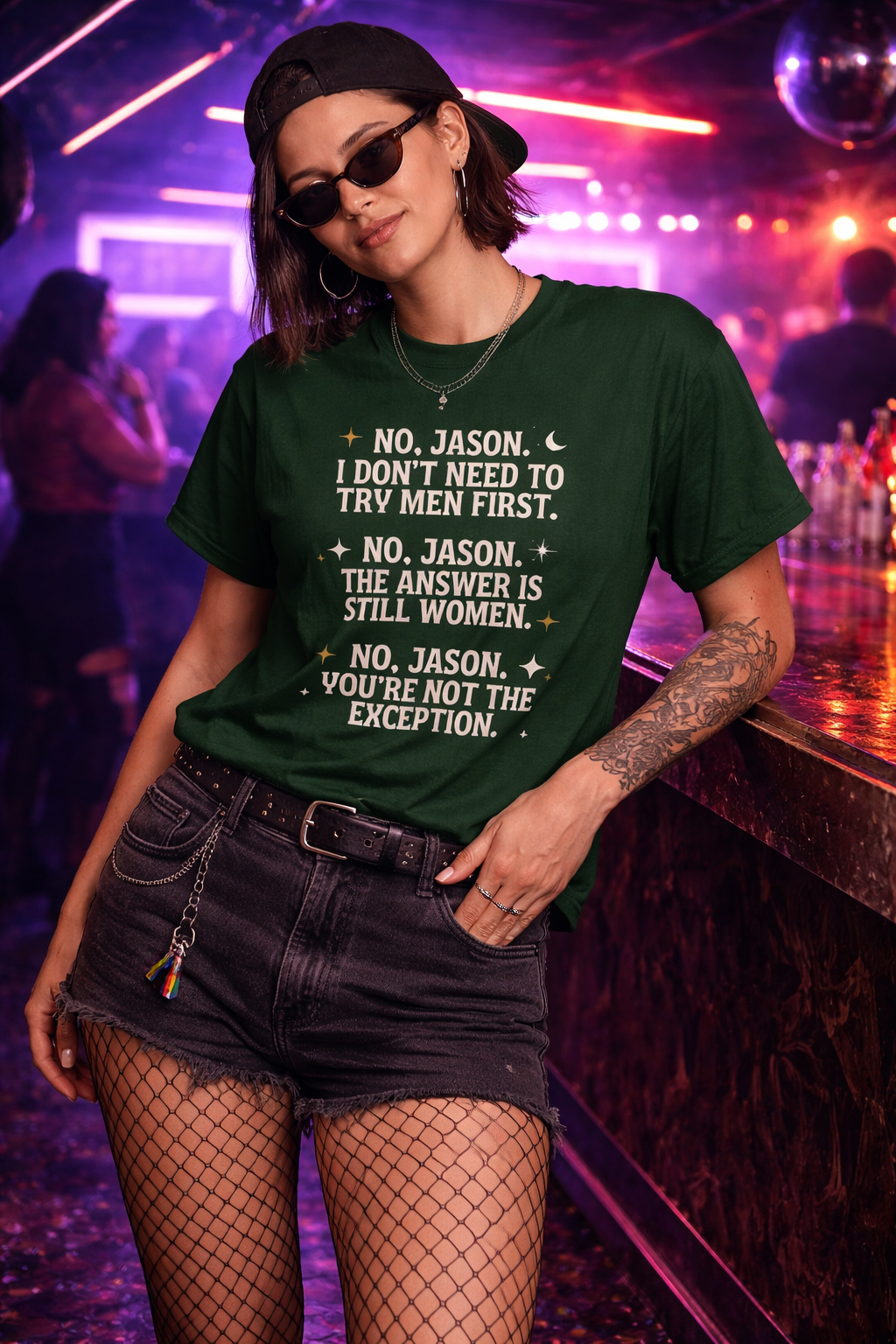 Person wearing a green t-shirt with text in a bar setting
