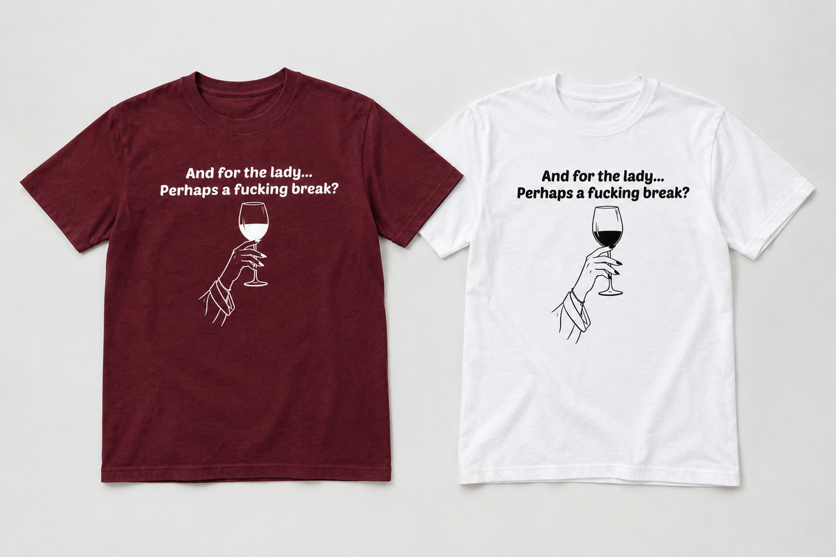 Two graphic t-shirts displayed side-by-side on a light gray background. The left t-shirt is maroon with a white graphic of a hand holding a wine glass and the text 'And for the lady.