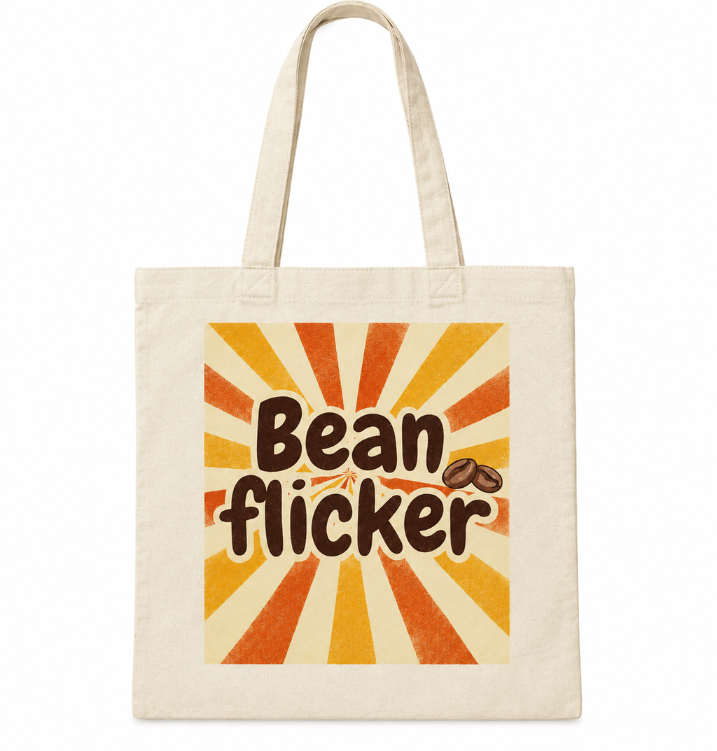 A cream-colored canvas tote bag with a retro sunburst graphic in orange, yellow, and beige, featuring the text 'Bean flicker' and two coffee beans.
