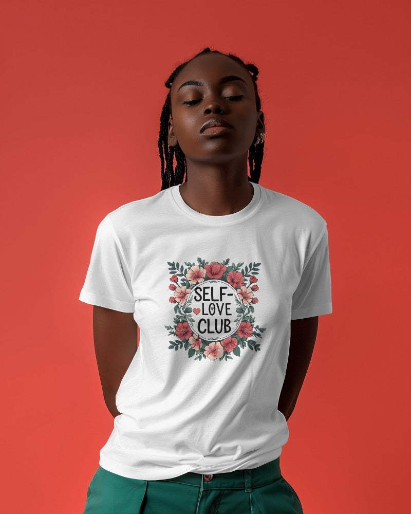 Woman wearing a "Love Yourself First" T-shirt in soft cotton, smiling confidently outdoors.