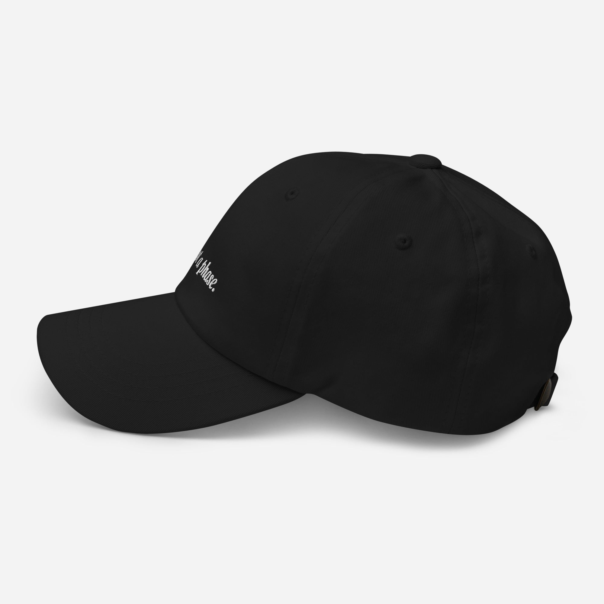 Black cap with a brand logo on a light gray background