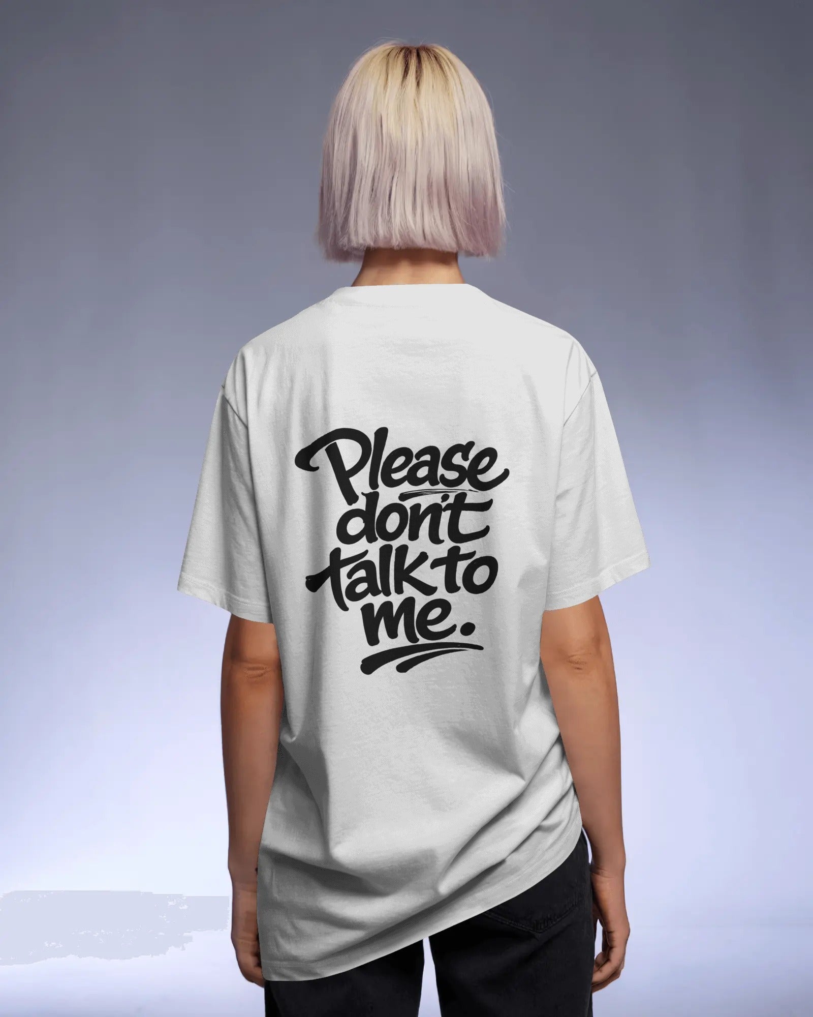 Model wearing a black oversized “Please Don’t Talk To Me” slogan t-shirt with relaxed fit and dropped shoulders, styled for everyday streetwear.
