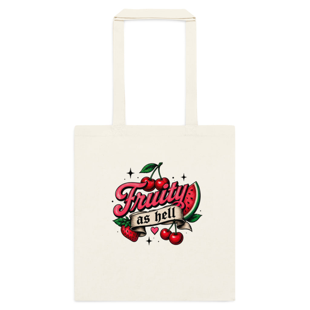 An off-white canvas tote bag with a retro-style graphic on the front featuring the text 'Fruity as hell' in pink script over red cherries and a watermelon slice.