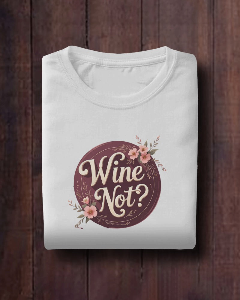 Front view of Wine Not? slogan T-shirt by Savage Cotton, in dusty rose with cream print, styled casually for summer