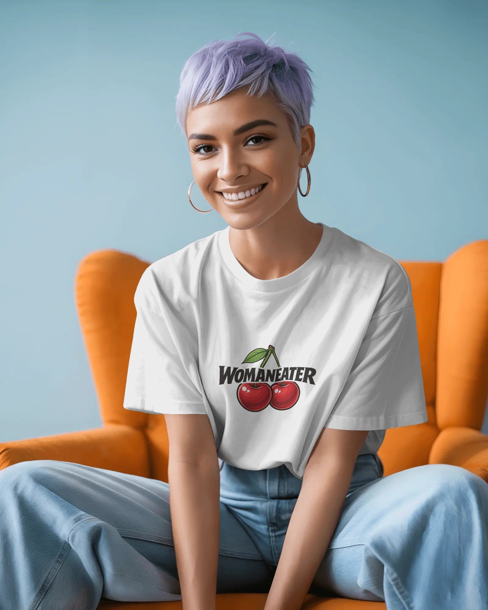 Womaneater slogan printed on a unisex t-shirt with bold black typography and playful sapphic design elements