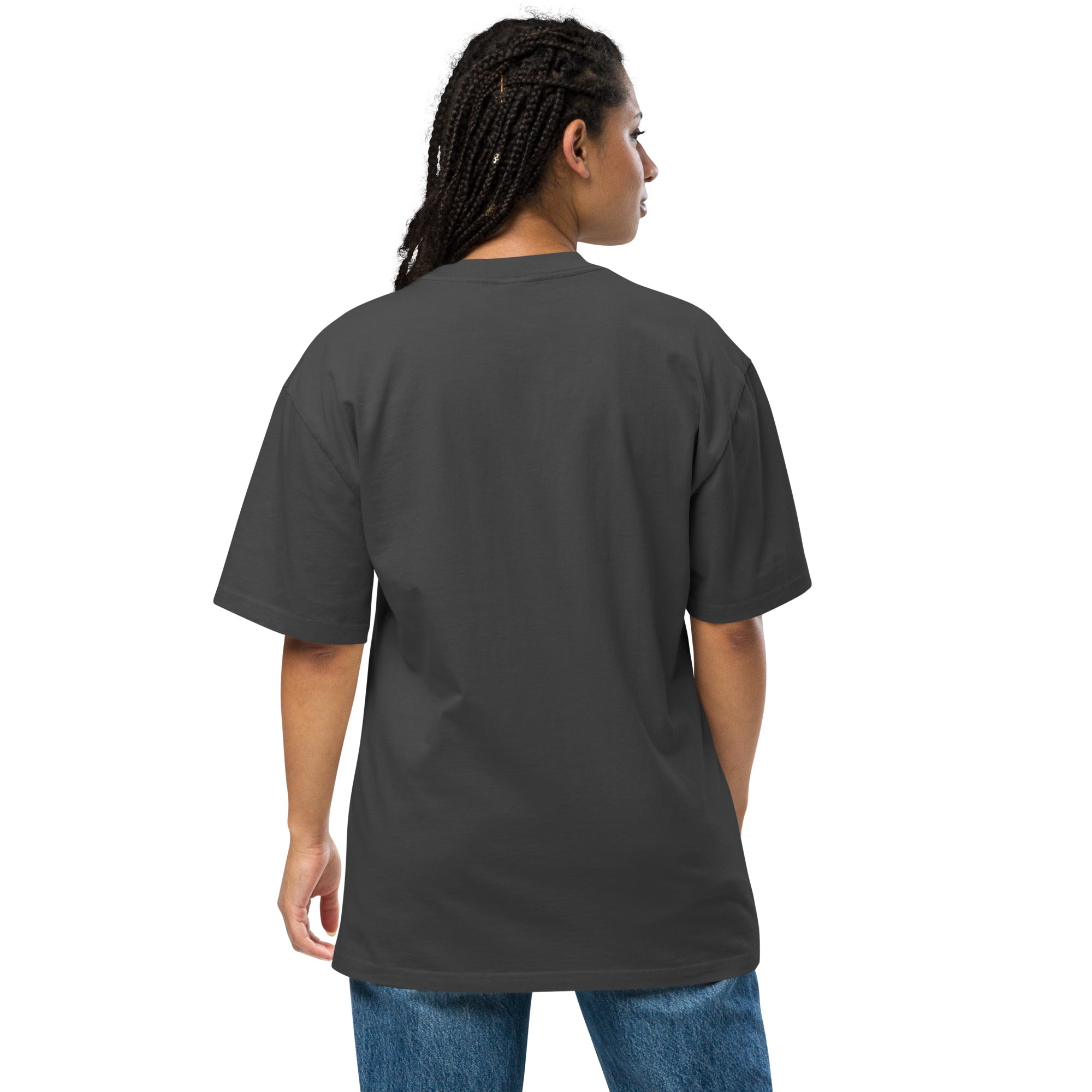 Person wearing a plain black t-shirt on a white background