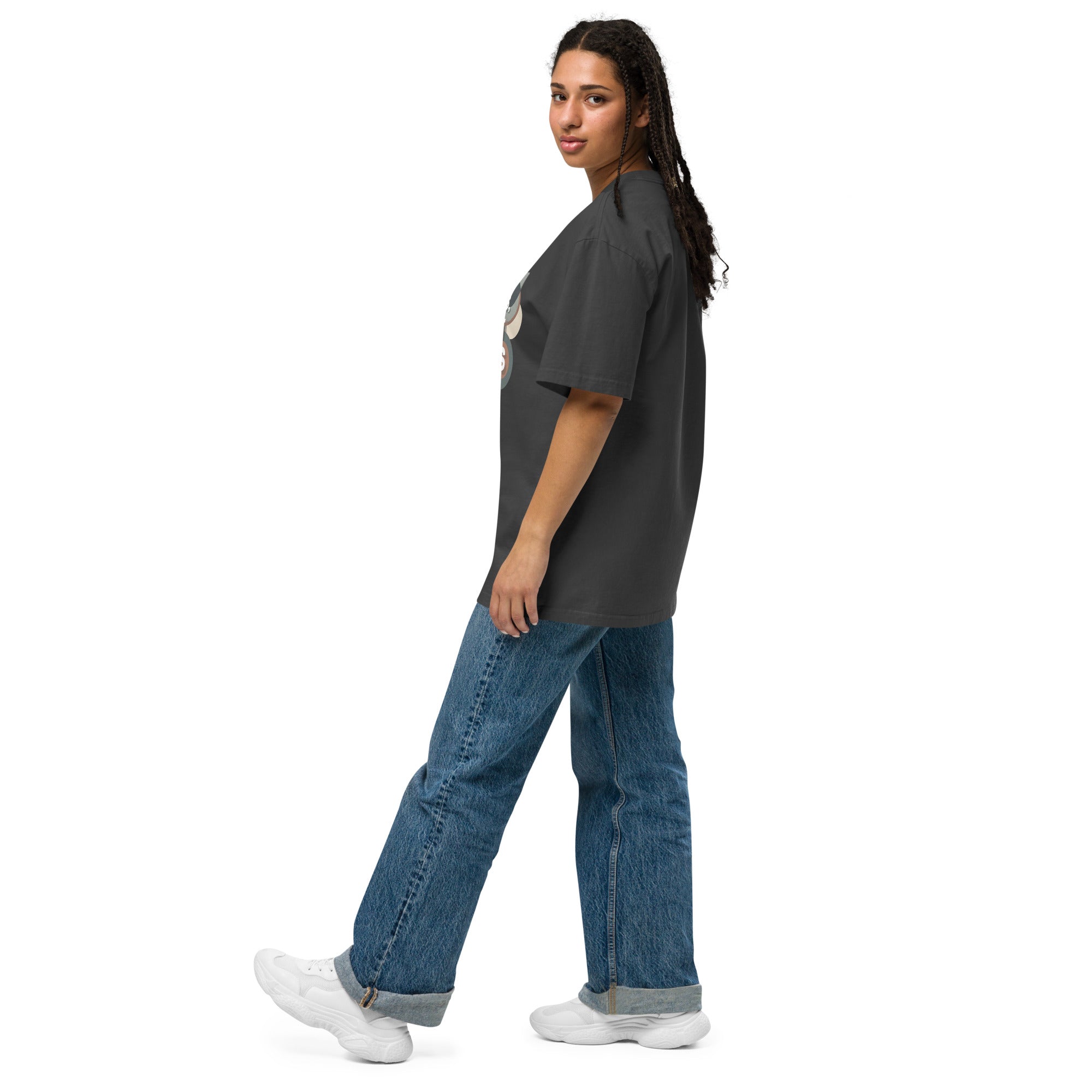Person wearing a gray t-shirt and blue jeans on a white background