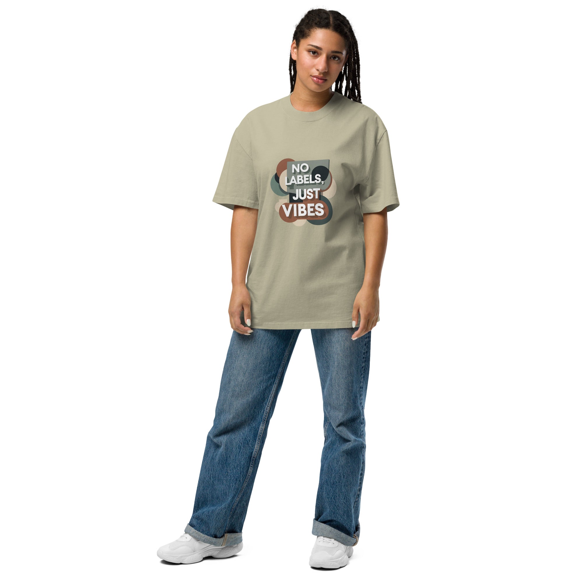 Person wearing a beige t-shirt with 'No Labels Just Vibes' text on a white background