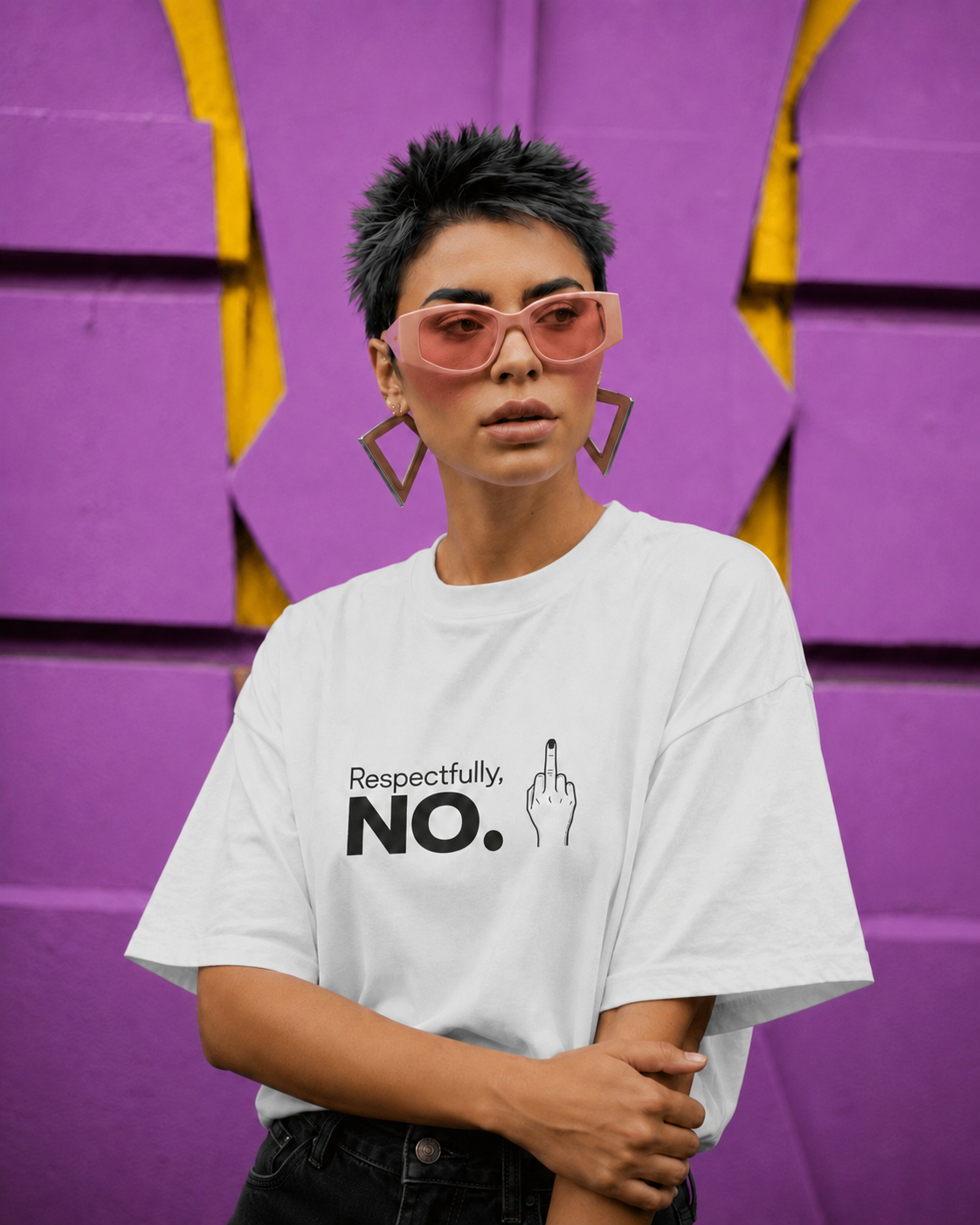 A model with short dark hair and geometric earrings wears a white graphic t-shirt with the text 'Respectfully. NO.