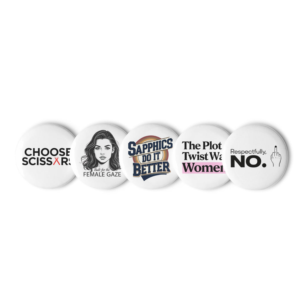 Close-up of five WLW-themed pins with glossy finish and bold queer designs