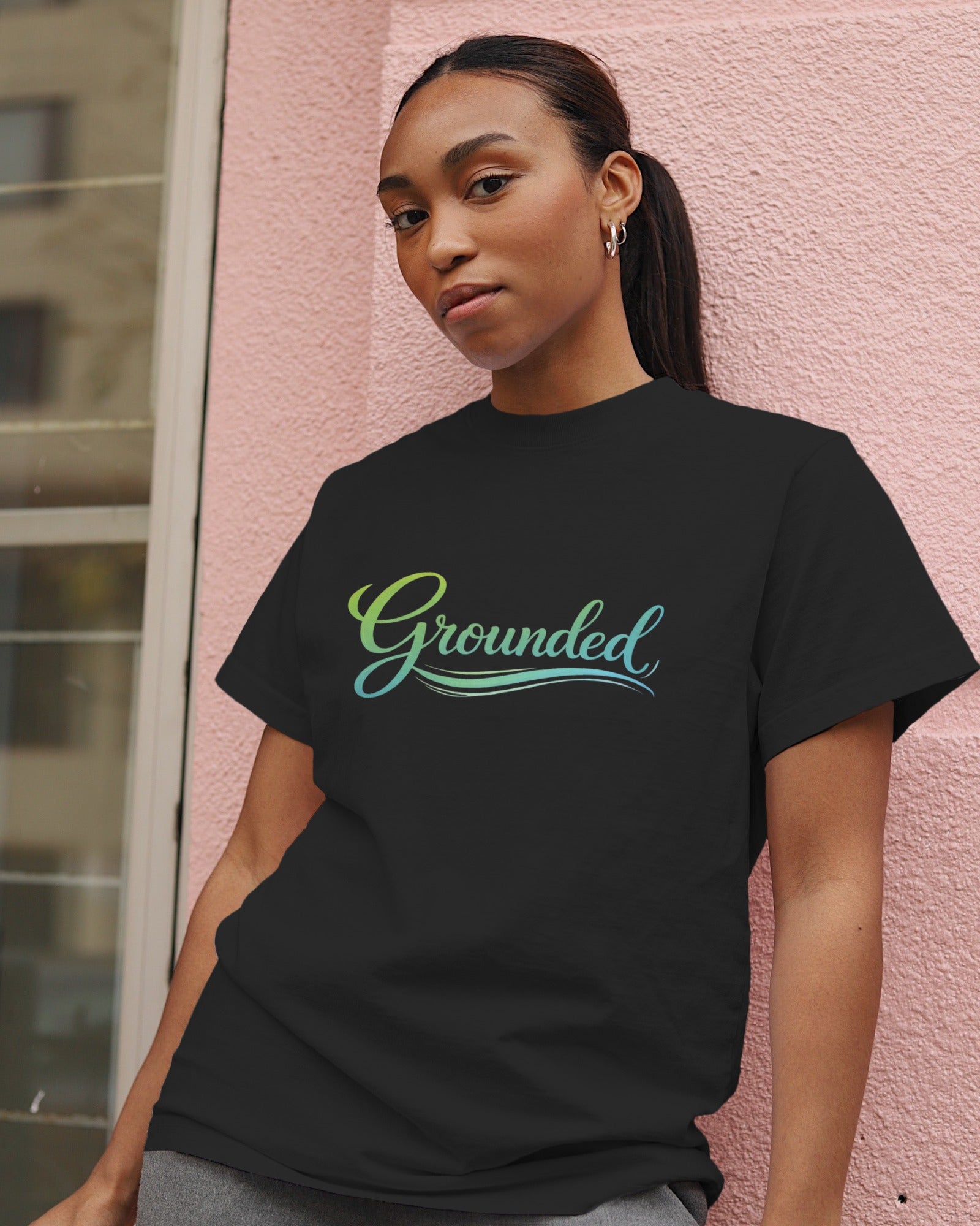 Grounded slogan printed on a minimalist unisex t-shirt with calm, understated typography