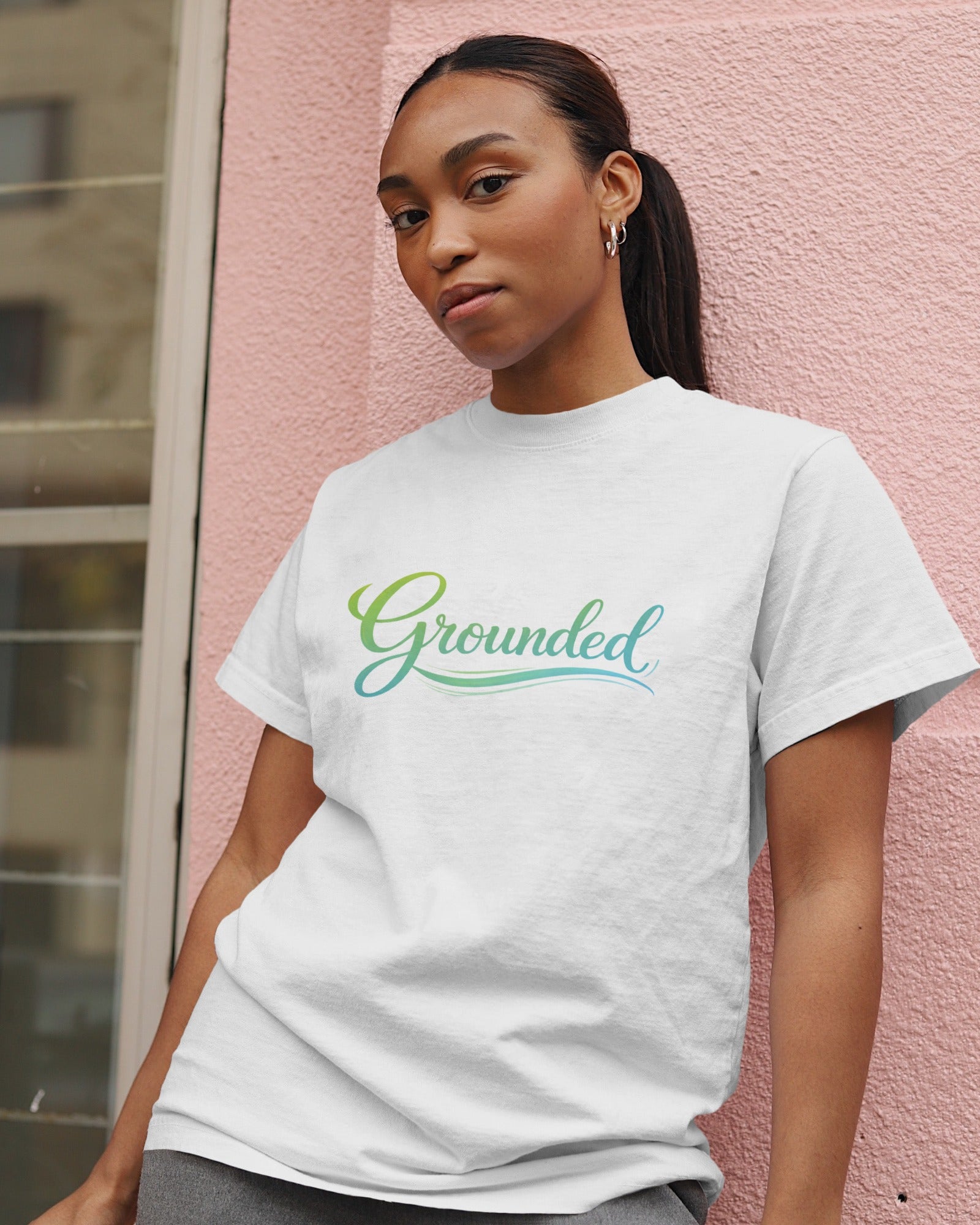 Grounded slogan printed on a minimalist unisex t-shirt with calm, understated typography