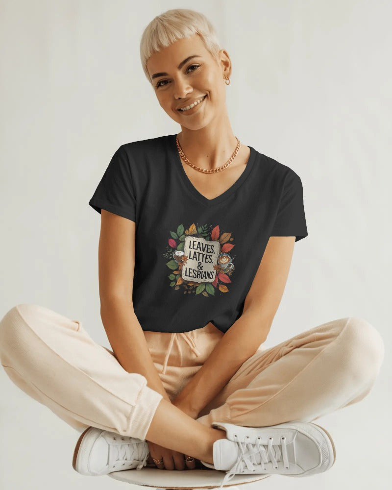 Person wearing a black t-shirt with a colorful graphic and text, sitting on a white background