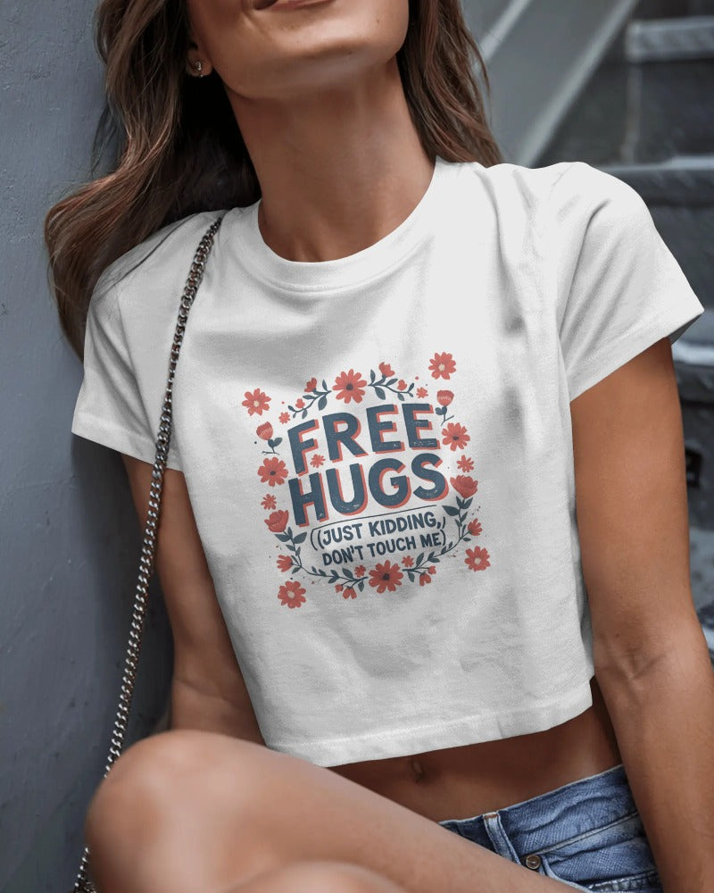 Close-up of bold text: Free Hugs… JK, Don’t Touch Me – Savage Cotton tee