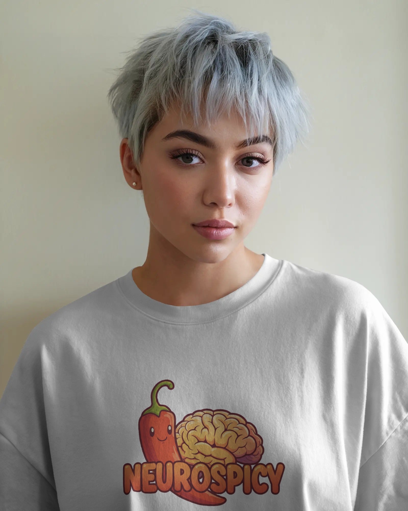 Neurospicy slogan t-shirt worn by a confident model, celebrating neurodivergence and mental health with bold, playful typography