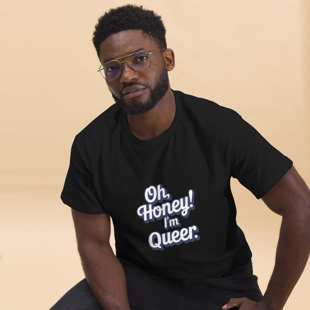Man wearing a black t-shirt with 'Oh, Honey! I'm Queer.' text on a beige background
