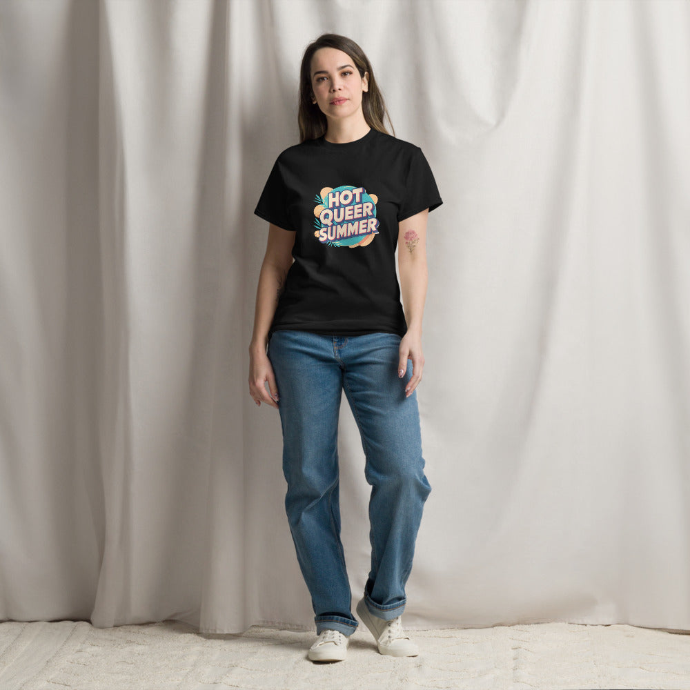 Person wearing a black t-shirt with colorful text and blue jeans standing against a plain background