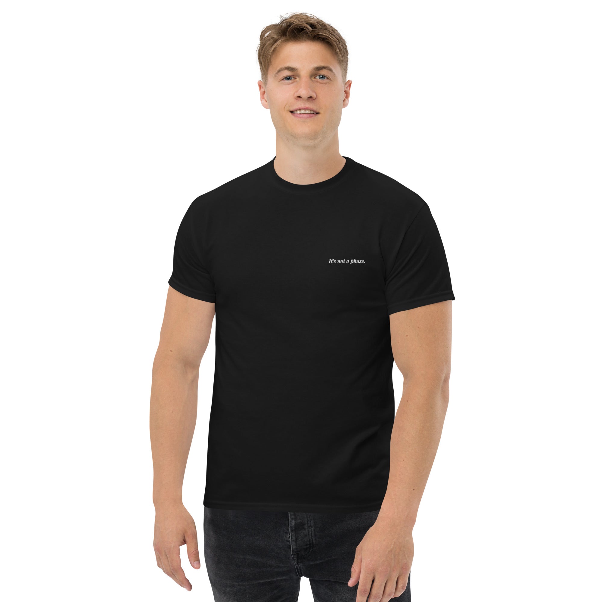 Man wearing a black t-shirt with text on a white background