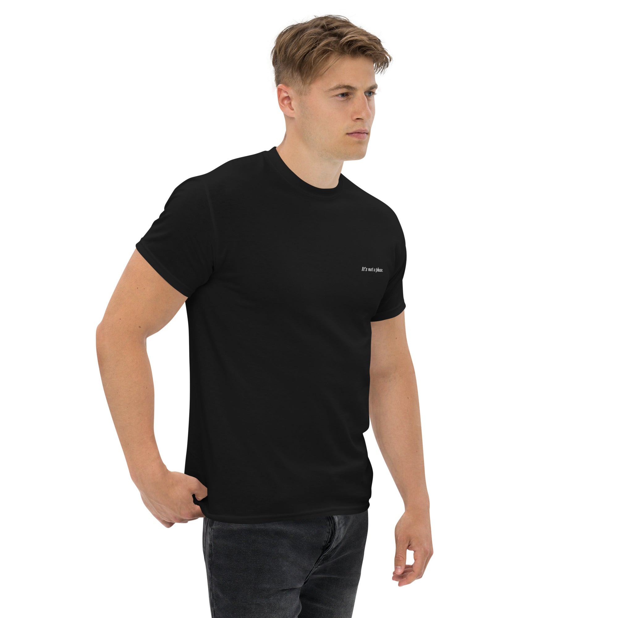 Man wearing a black t-shirt with a logo on a white background