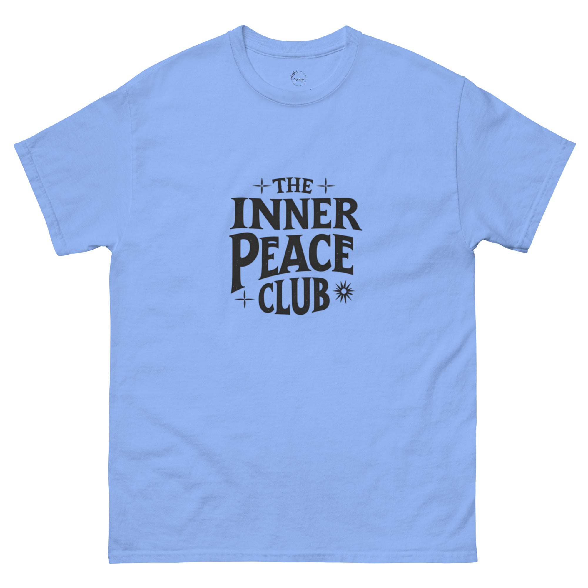 Flat lay of a cream-colored “The Inner Peace Club” t-shirt with soft lettering, styled with pastel accessories and cozy neutral tones.