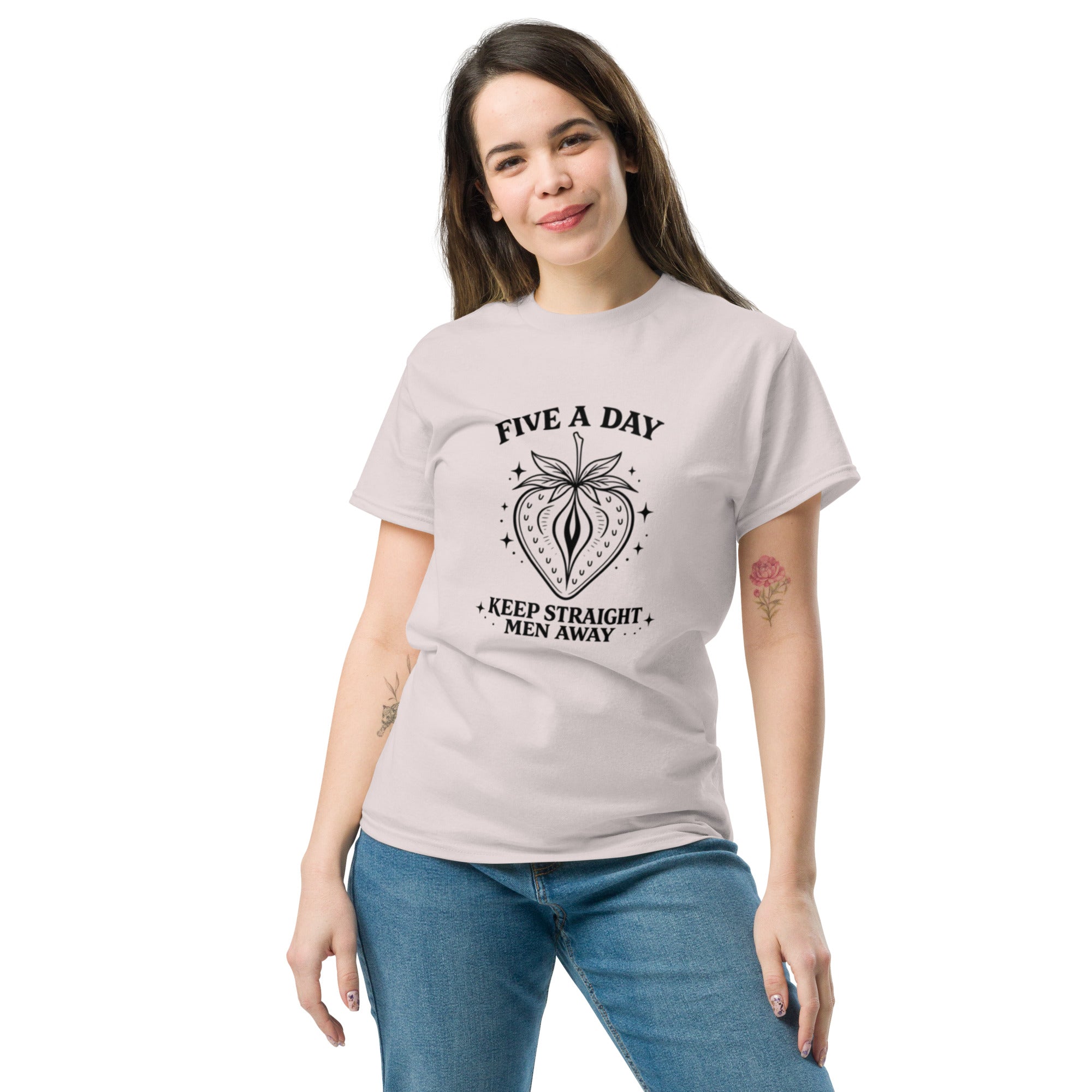 Woman wearing a light gray t-shirt with 'And So The Adventure Begins' text on a white background
