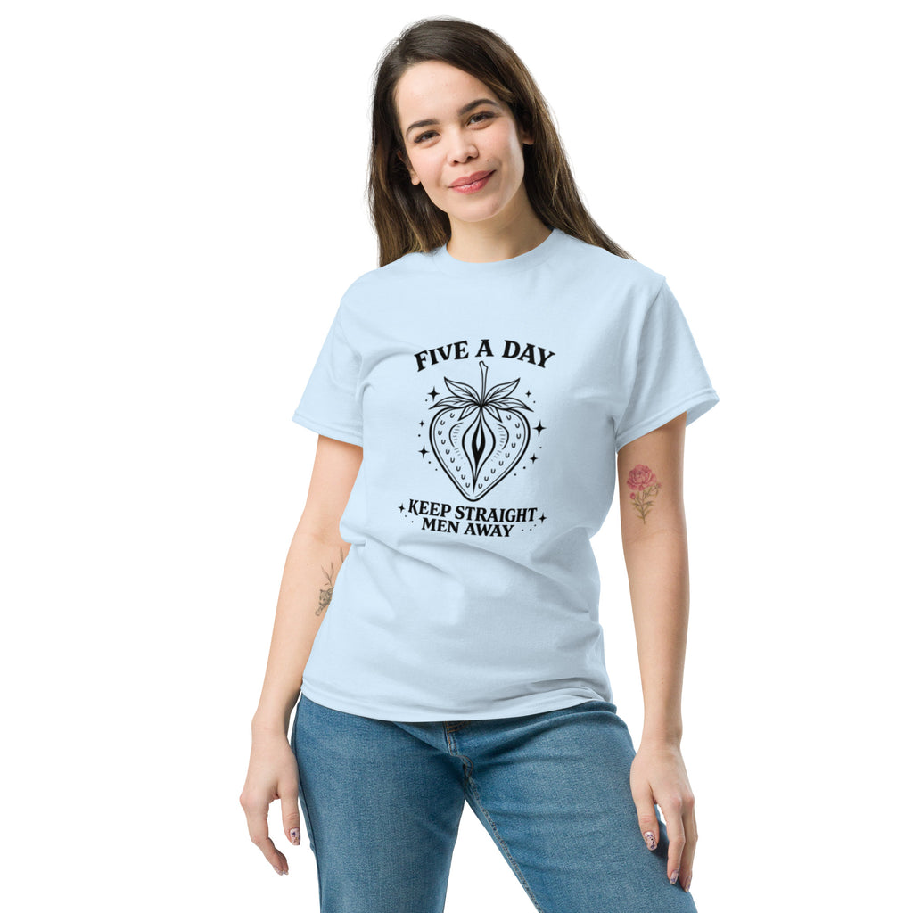 Woman wearing a light blue t-shirt with a car graphic on a white background