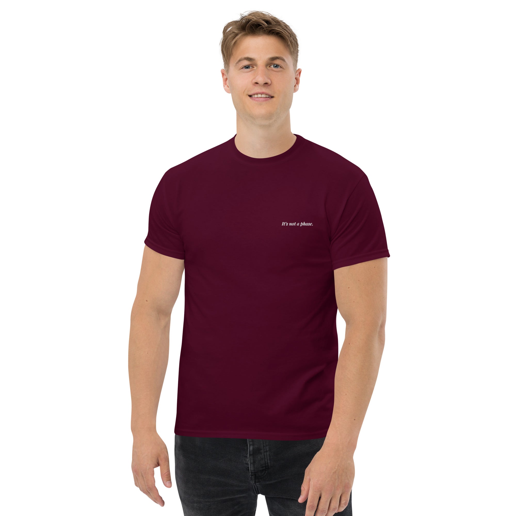 Man wearing a maroon t-shirt with text on a white background