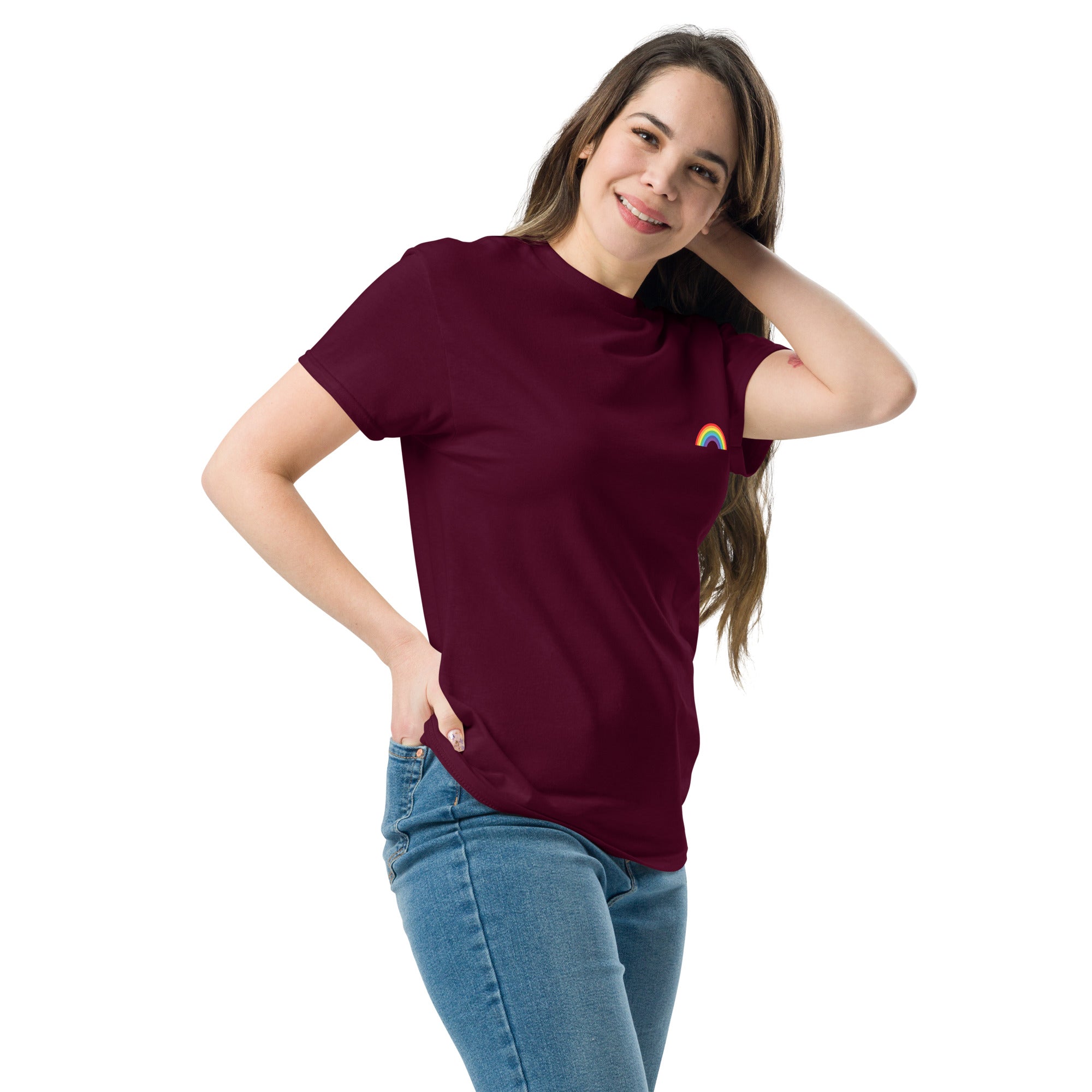Woman wearing a maroon t-shirt with a rainbow design on a white background