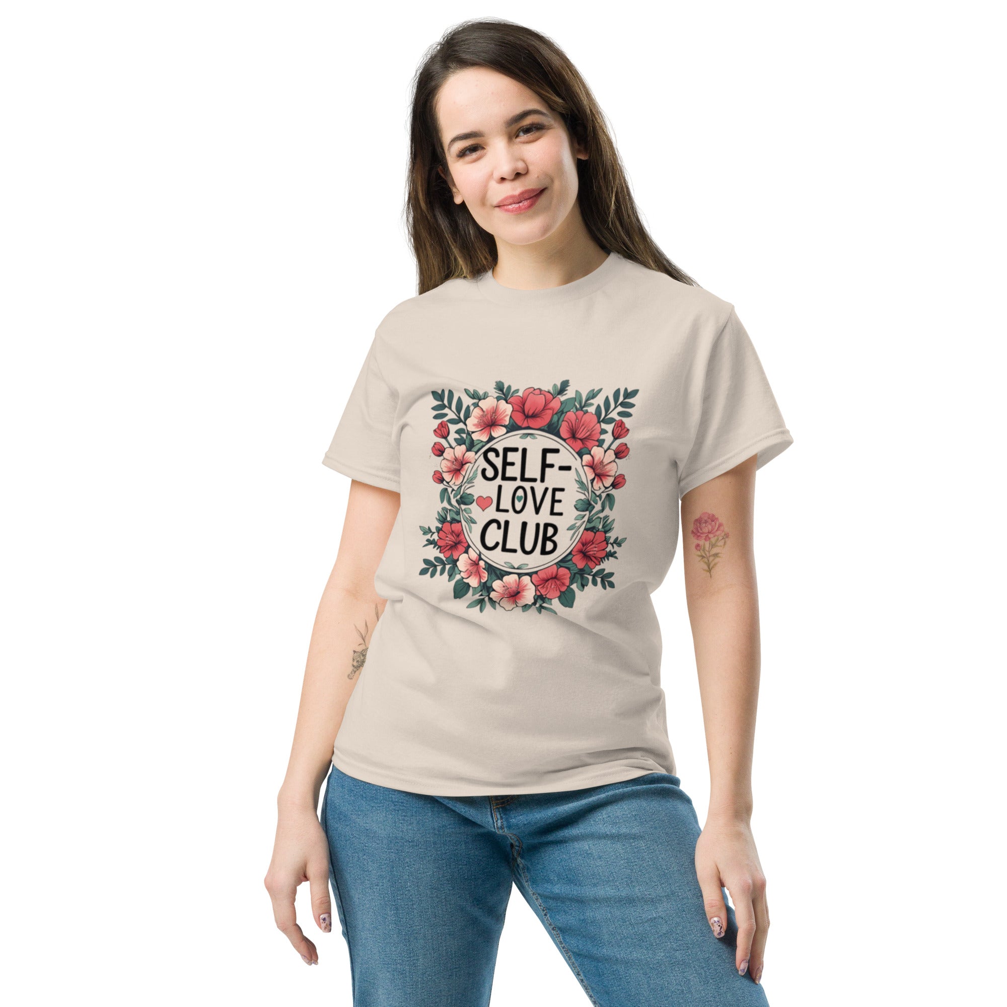 Woman wearing a "Love Yourself First" T-shirt in soft cotton, smiling confidently outdoors.
