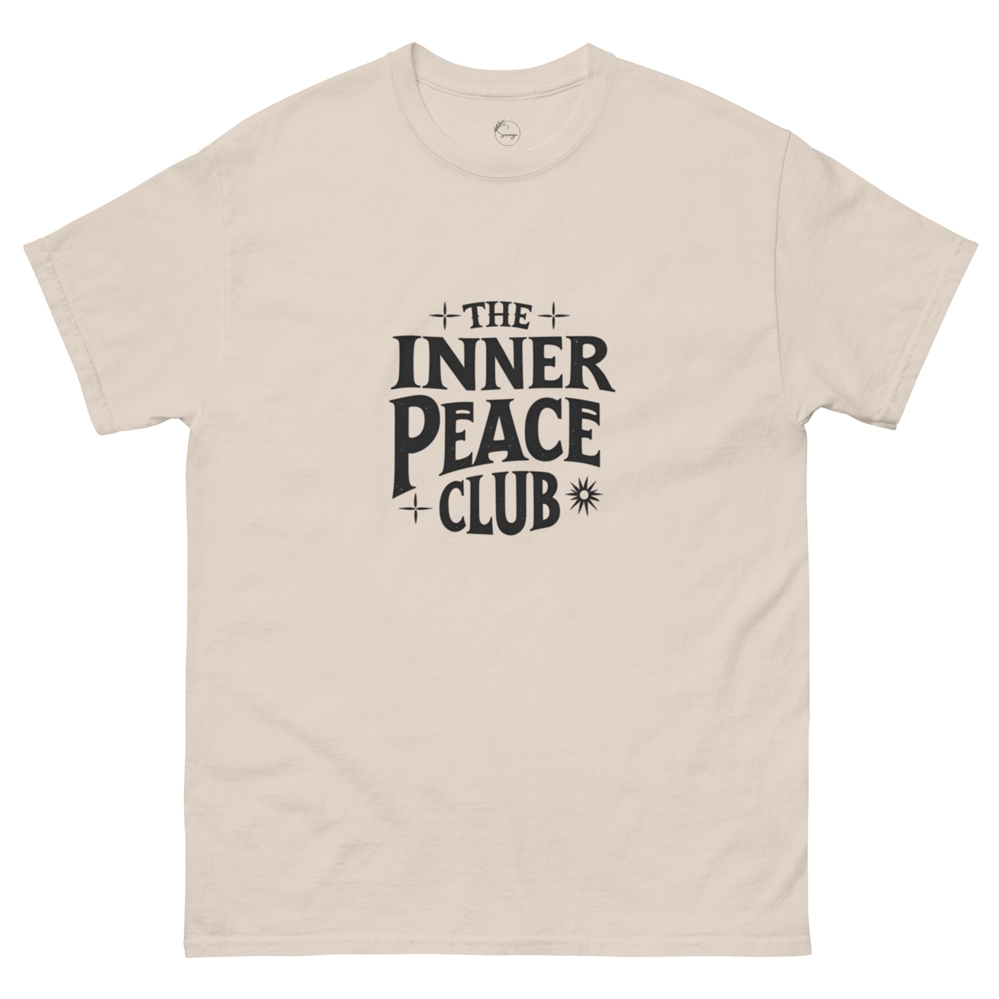 Flat lay of a cream-colored “The Inner Peace Club” t-shirt with soft lettering, styled with pastel accessories and cozy neutral tones.