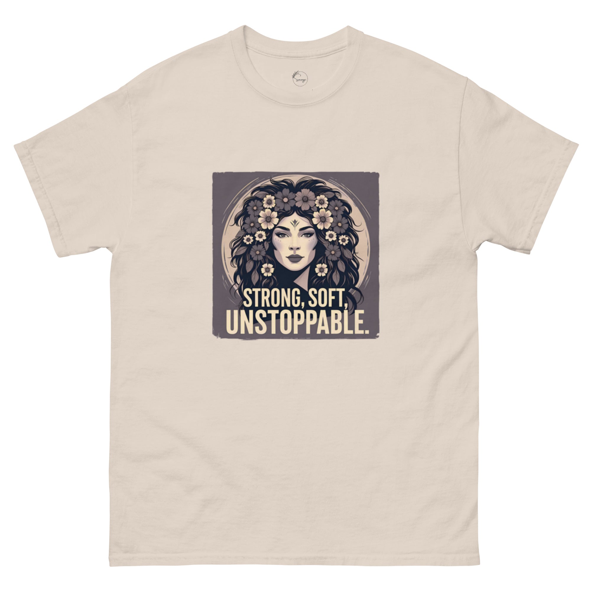 Beige t-shirt with a graphic of a woman with flowers and the text 'Strong, Soft, Unstoppable' on a white background.