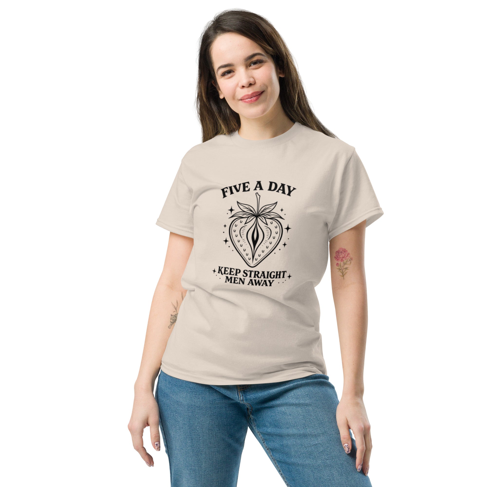 Woman wearing a beige t-shirt with a floral design and text on a white background