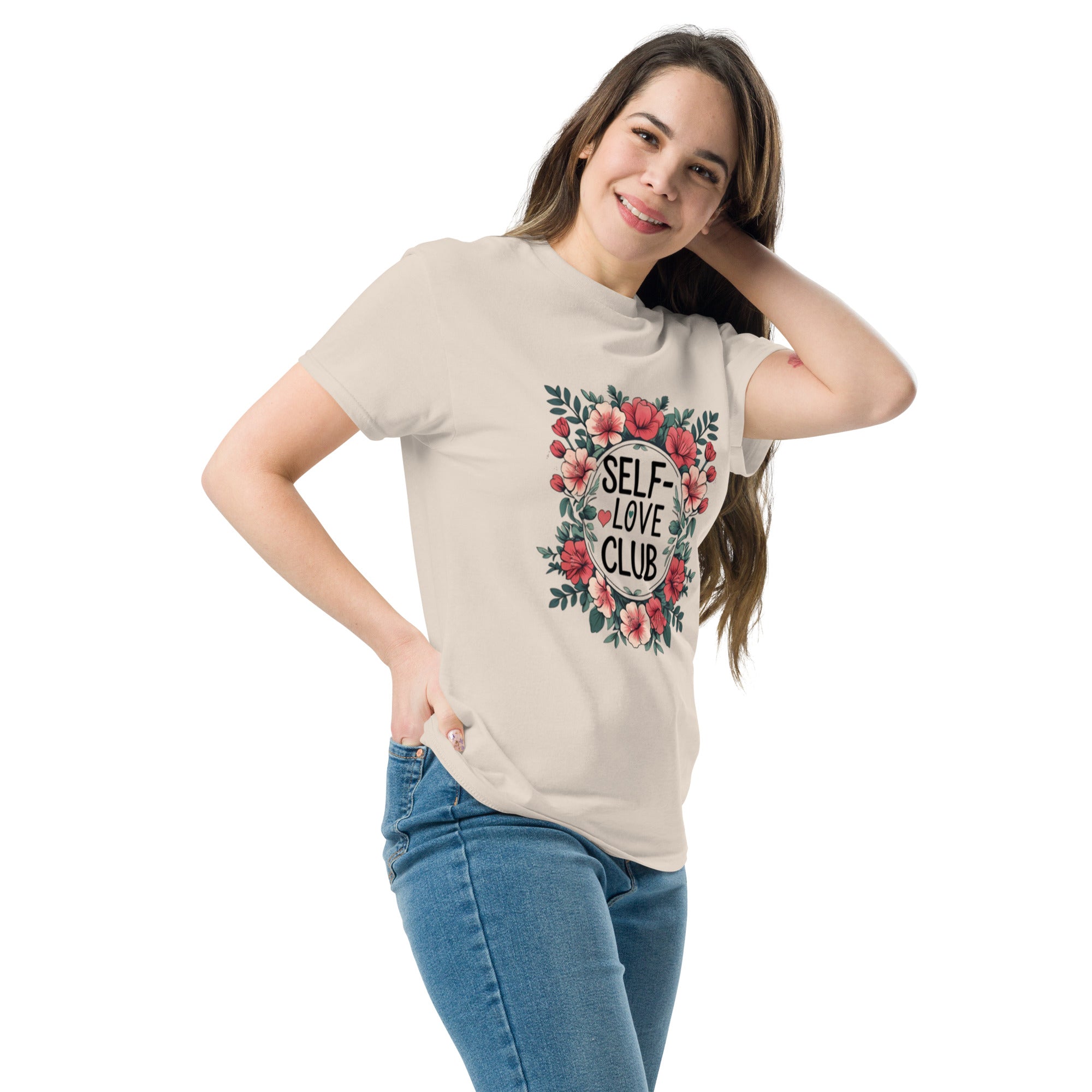 Woman wearing a "Love Yourself First" T-shirt in soft cotton, smiling confidently outdoors.