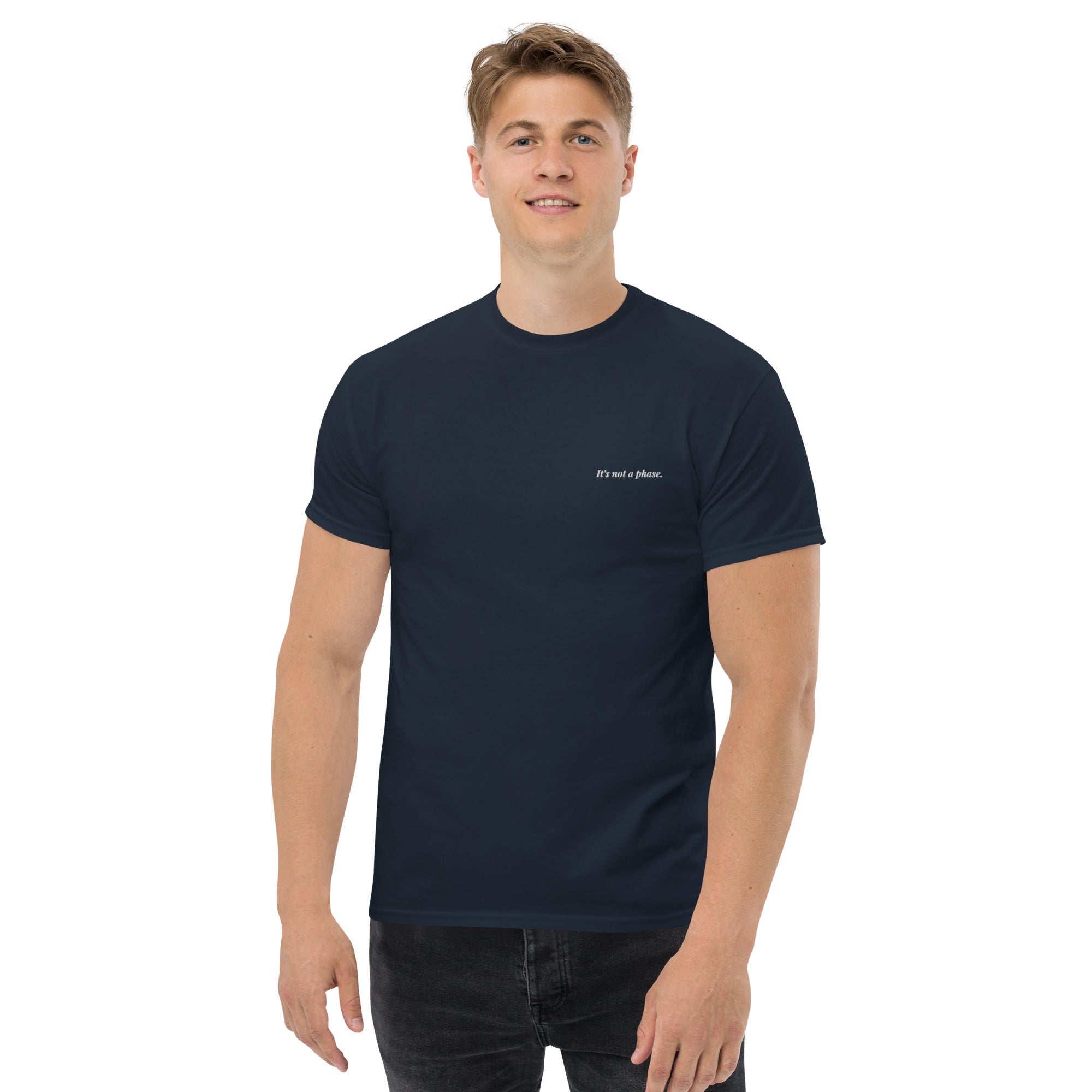 Man wearing a navy blue t-shirt with text on a white background