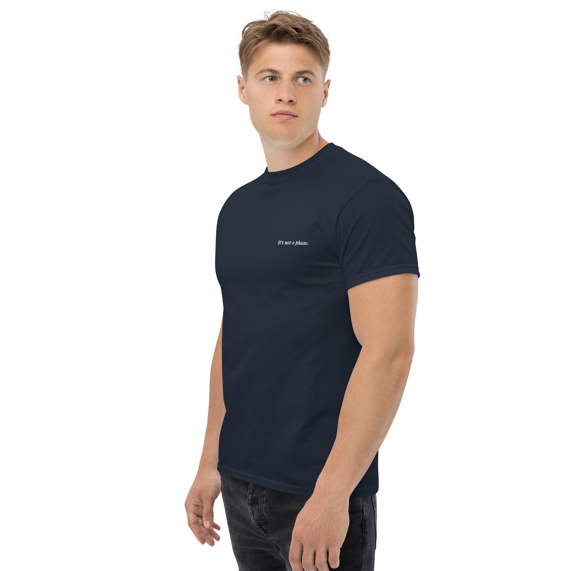 Man wearing a navy blue t-shirt with a logo on a white background
