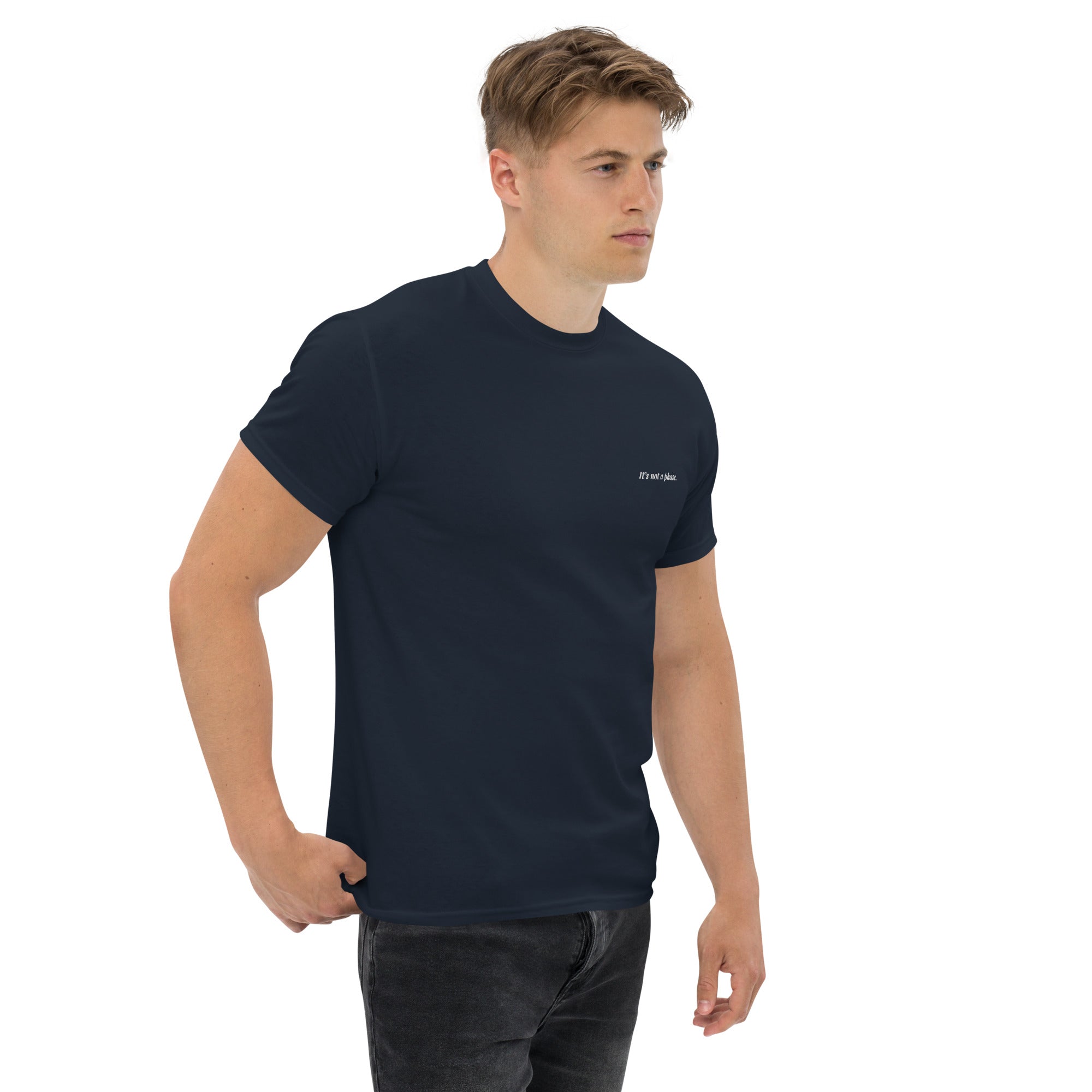 Man wearing a navy blue t-shirt with a logo on a white background