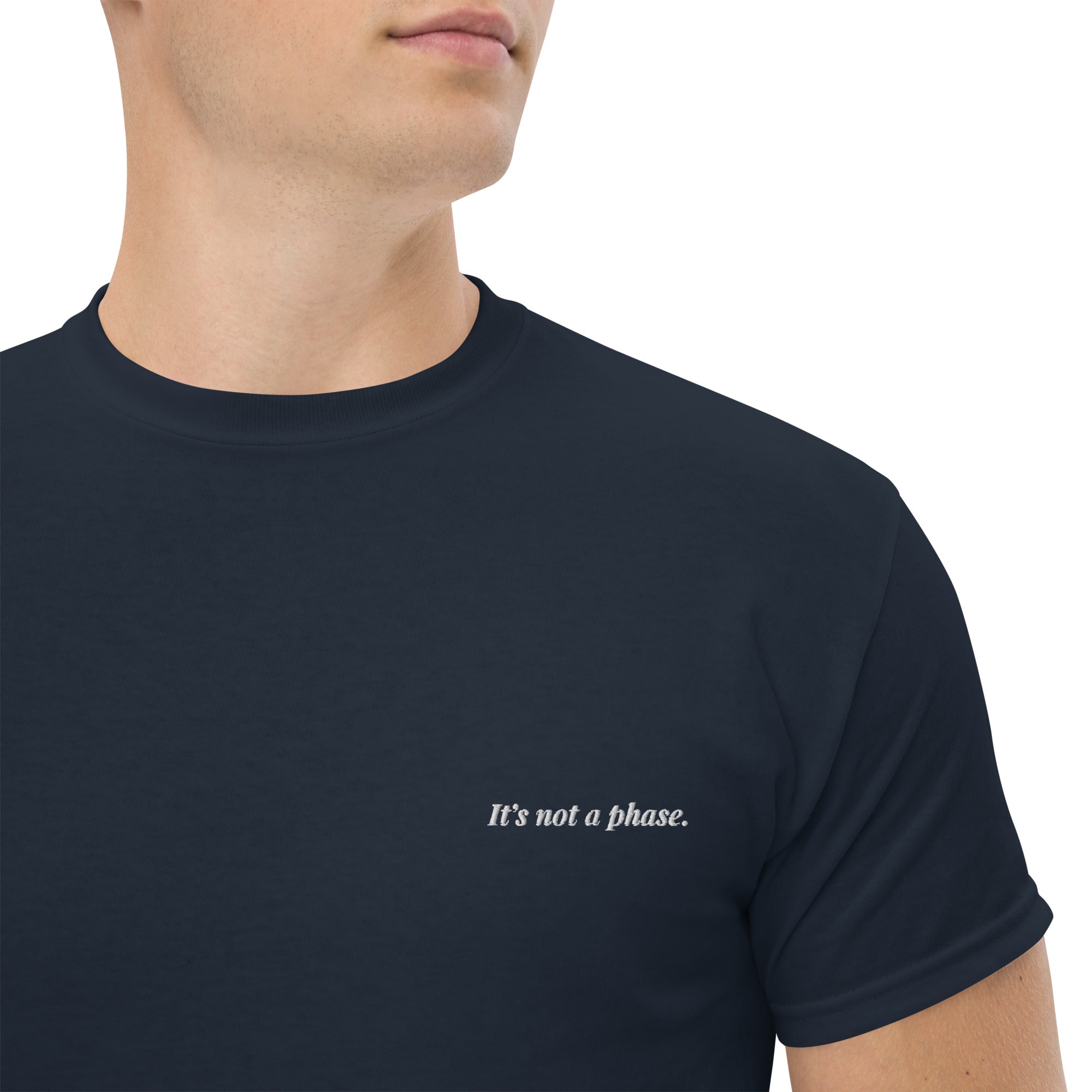 Navy blue t-shirt with 'It's not a phase.' text on a white background