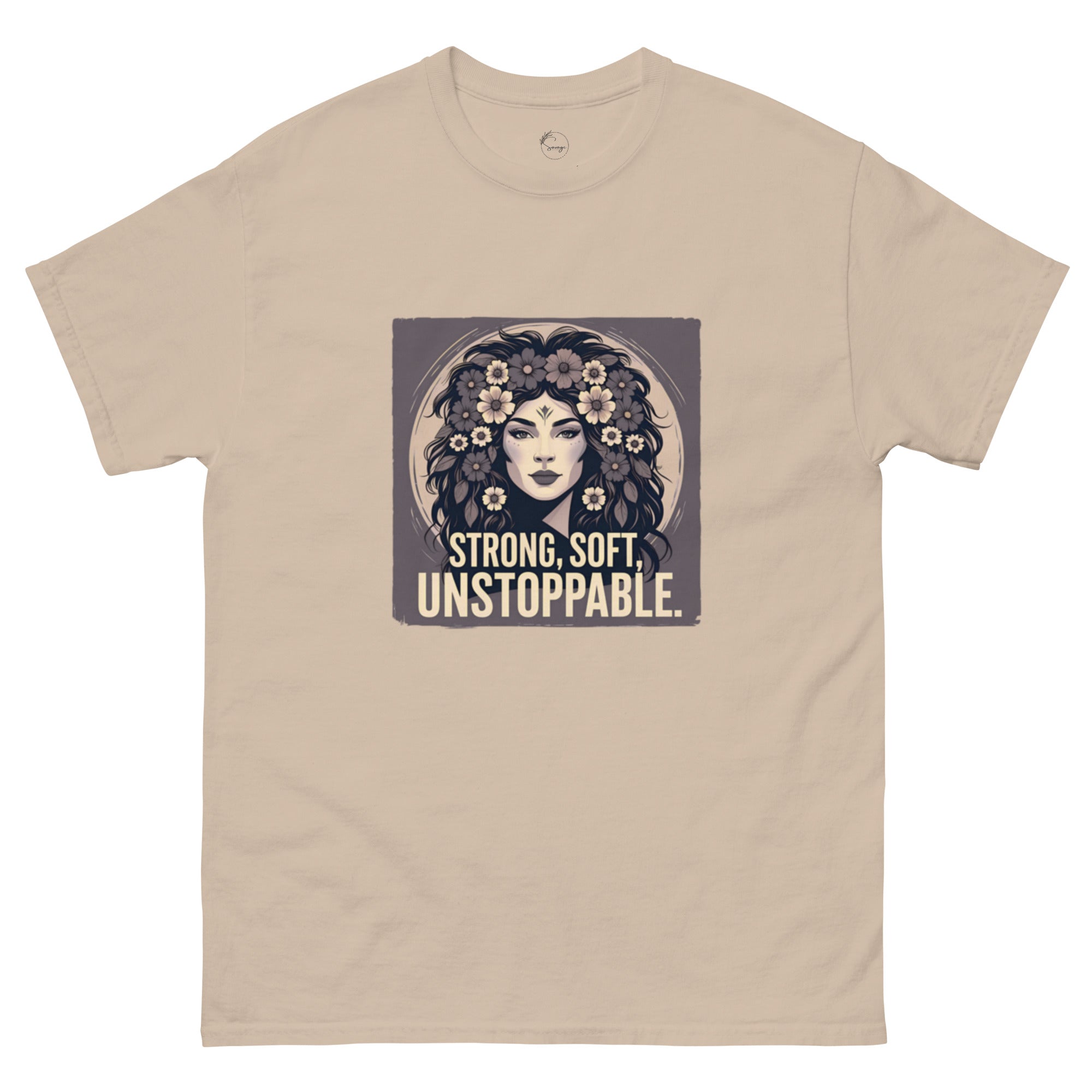 Beige t-shirt with a graphic of a woman with flowers and the text 'Strong, Soft, Unstoppable' on a white background.