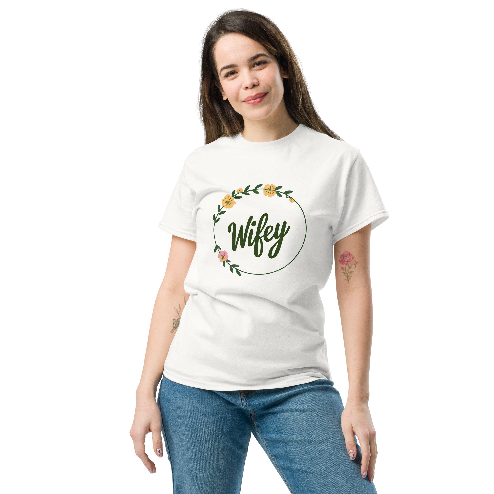 Woman wearing a white t-shirt with 'Wifey' and floral design on a white background