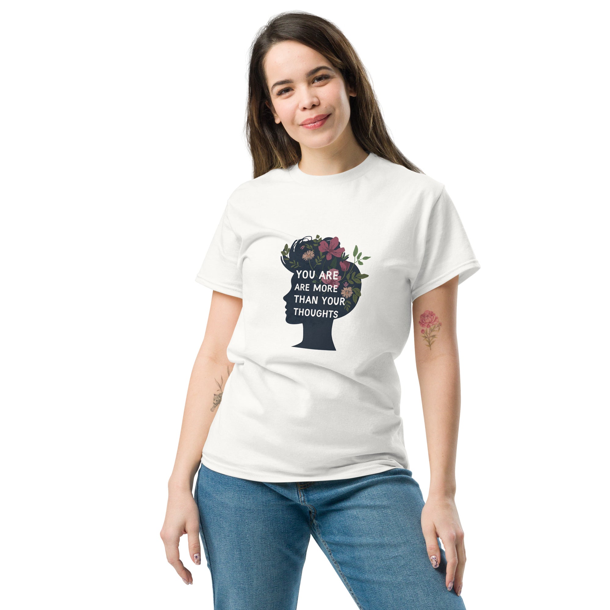 Woman wearing a white t-shirt with a graphic design and text on a white background