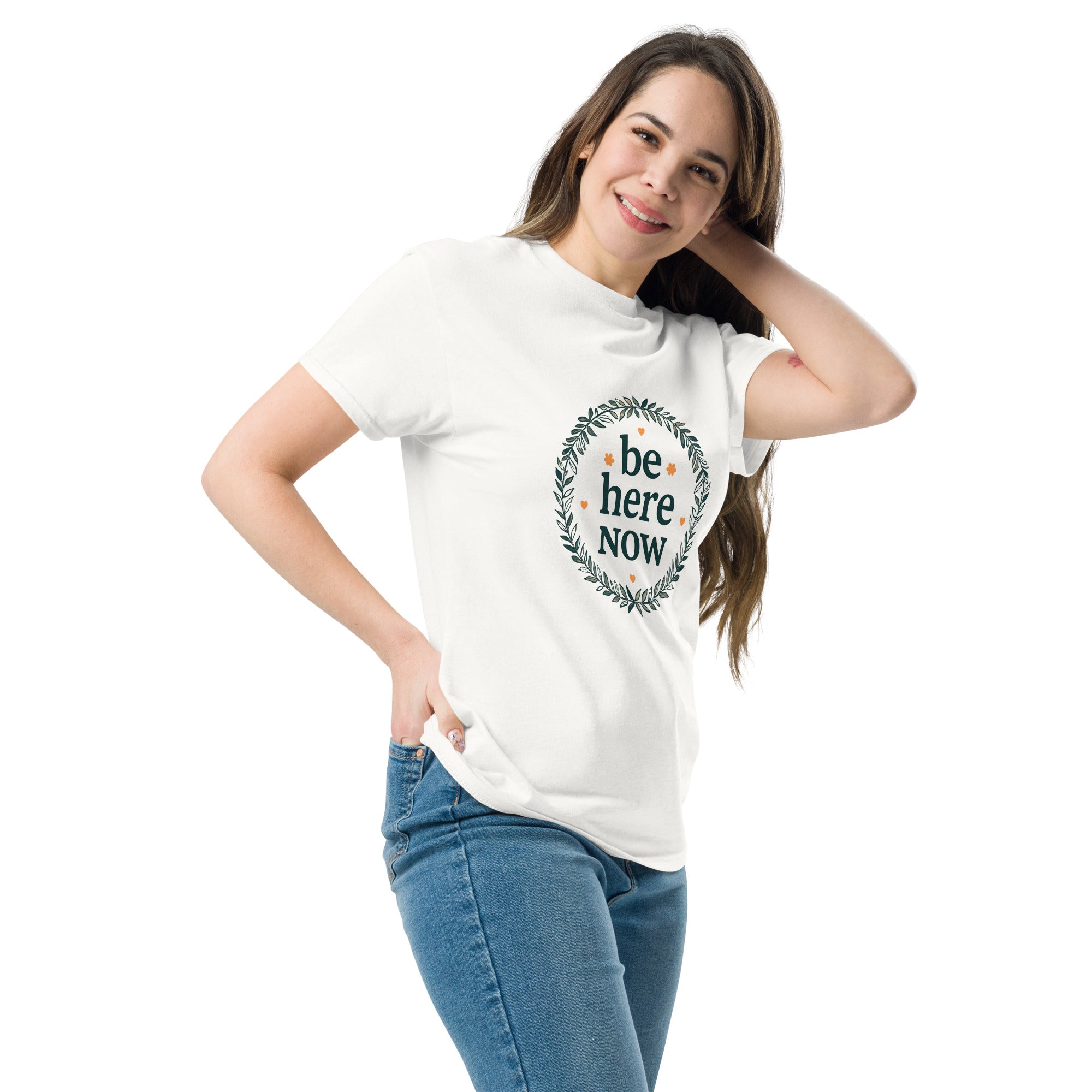 Woman wearing a white t-shirt with 'be here NOW' text design on a white background