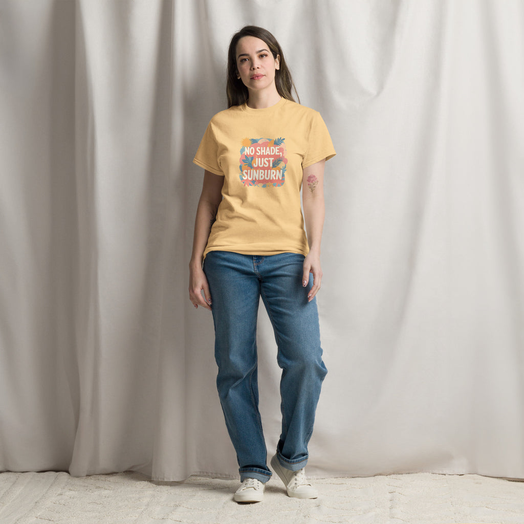 Model wearing No Shade, Just Sunburn slogan T-shirt by Savage Cotton in sunshine yellow, styled with sunglasses and a Pride flag