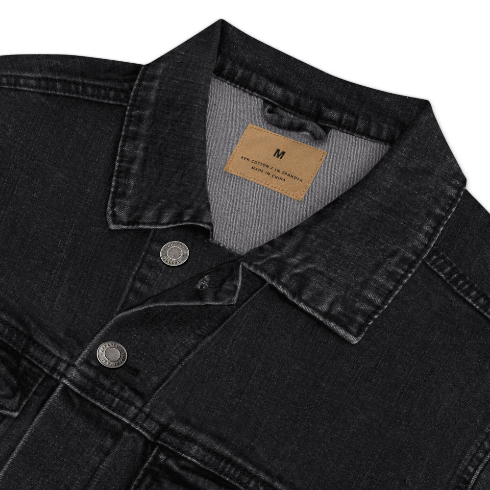 Close-up of a black denim jacket collar with a brand label on a white background