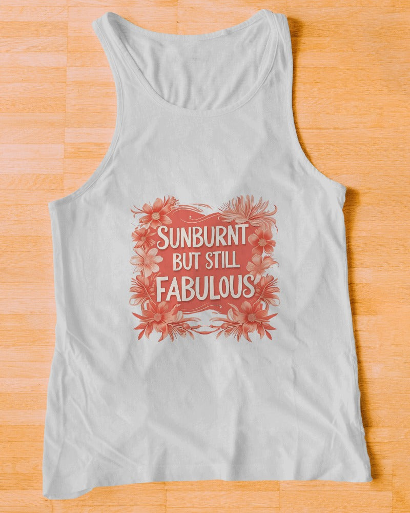 Model wearing the Sunburnt but Fabulous slogan tank top by Savage Cotton in soft peach, styled for summer with sunglasses and attitude