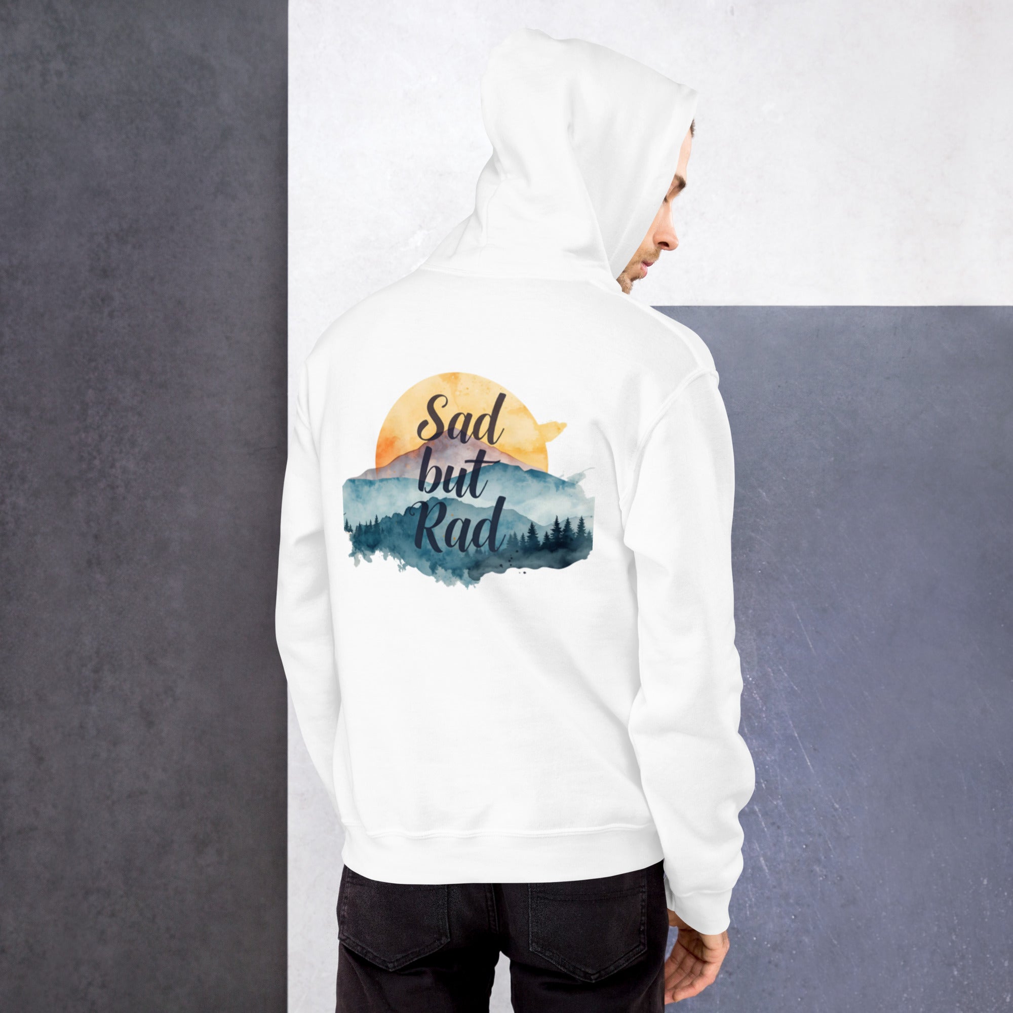 Person wearing a white hoodie with 'Sad but Rad' design on a gray background