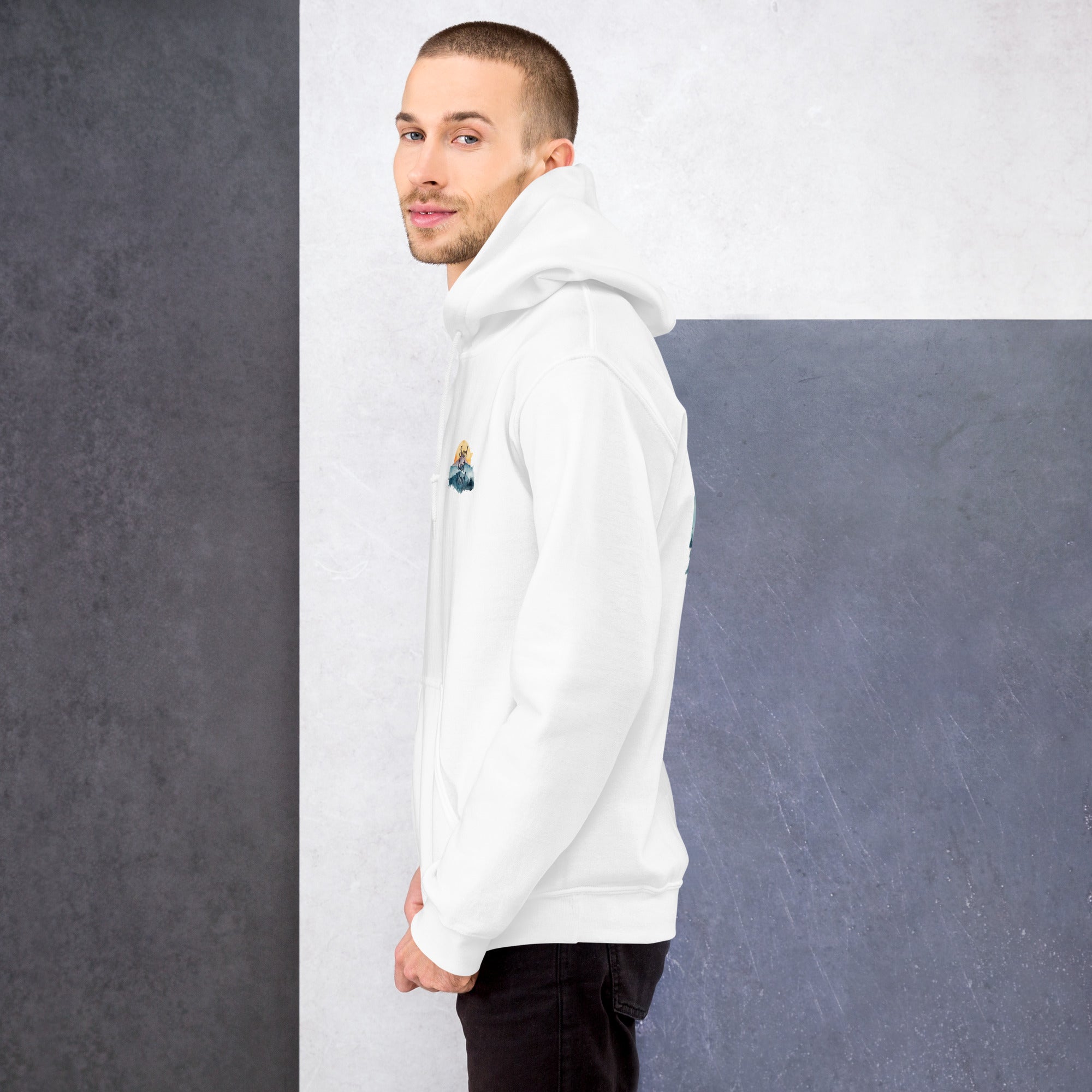 Man wearing a white hoodie with a small graphic on a gray and white background