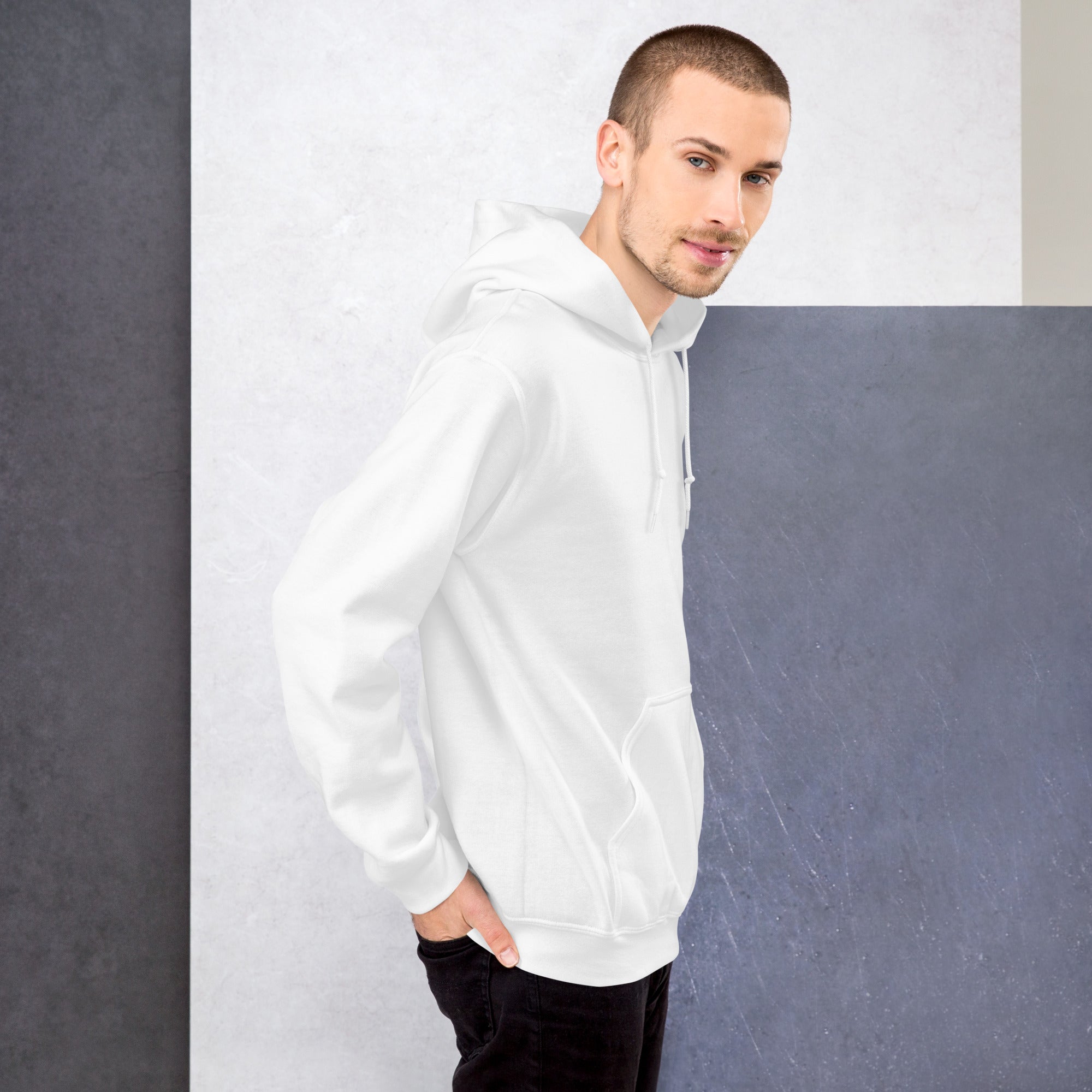 Man wearing a white hoodie against a gray background